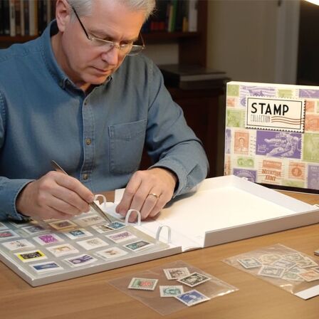 Stamp Collecting Binder Kit<br>Full Size Binder Man collecting and organizing stamps in stamp collecting binder